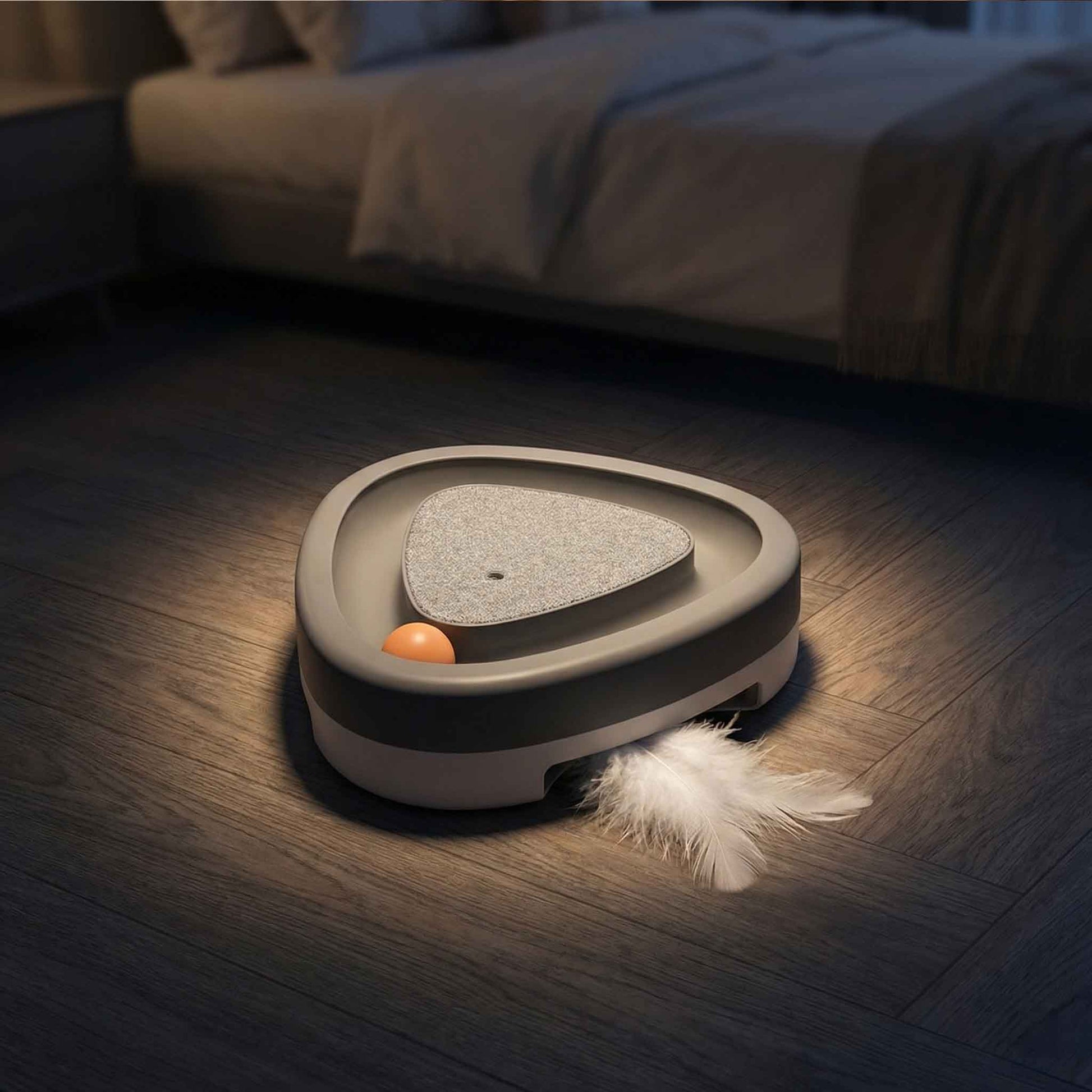 cat playing with automatic feather toy